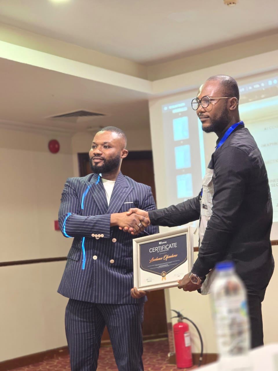 Mr. Ofosuhene is receiving his Mindsspark Certificate.